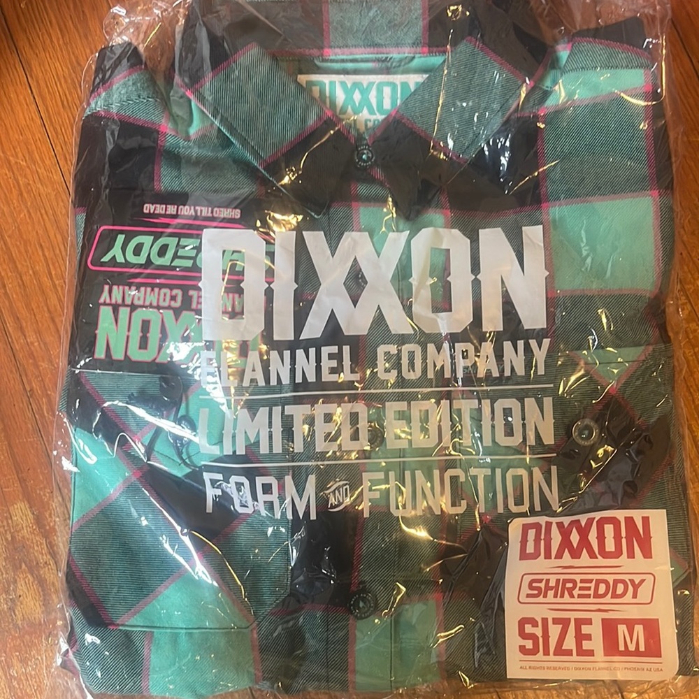 brand new dixxion flannel still in packaging with tags